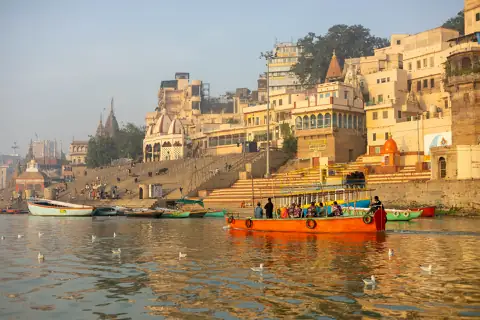 Varanasi ghats at dawn, boats on the Ganga