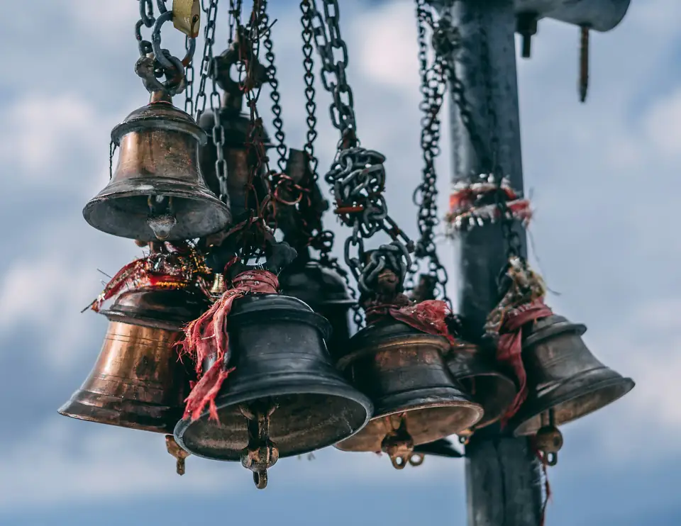 Brass temple bells hanging on chains